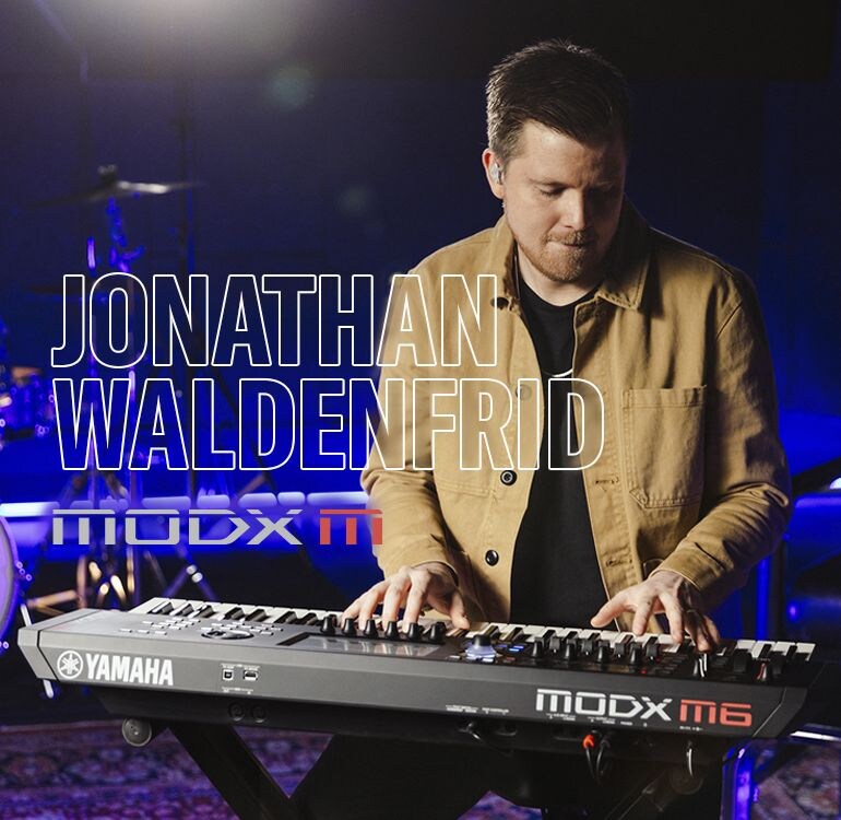 Visual of Jonathan Waldenfrid playing a synthesizer in a performance scene