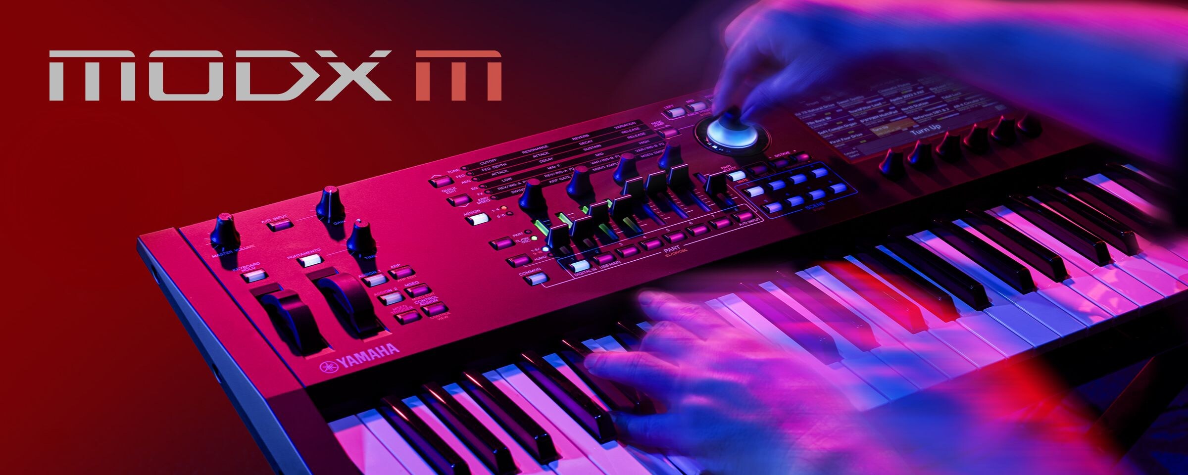 Artistic visual focusing on hands playing a synthesizer in a performance scene