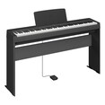Diagonal side view of the P-145B (black model) in combination with the optional stand and sustain pedal