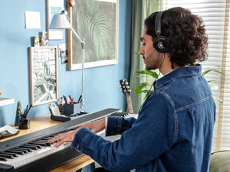 A person using headphones while practicing on the P-223